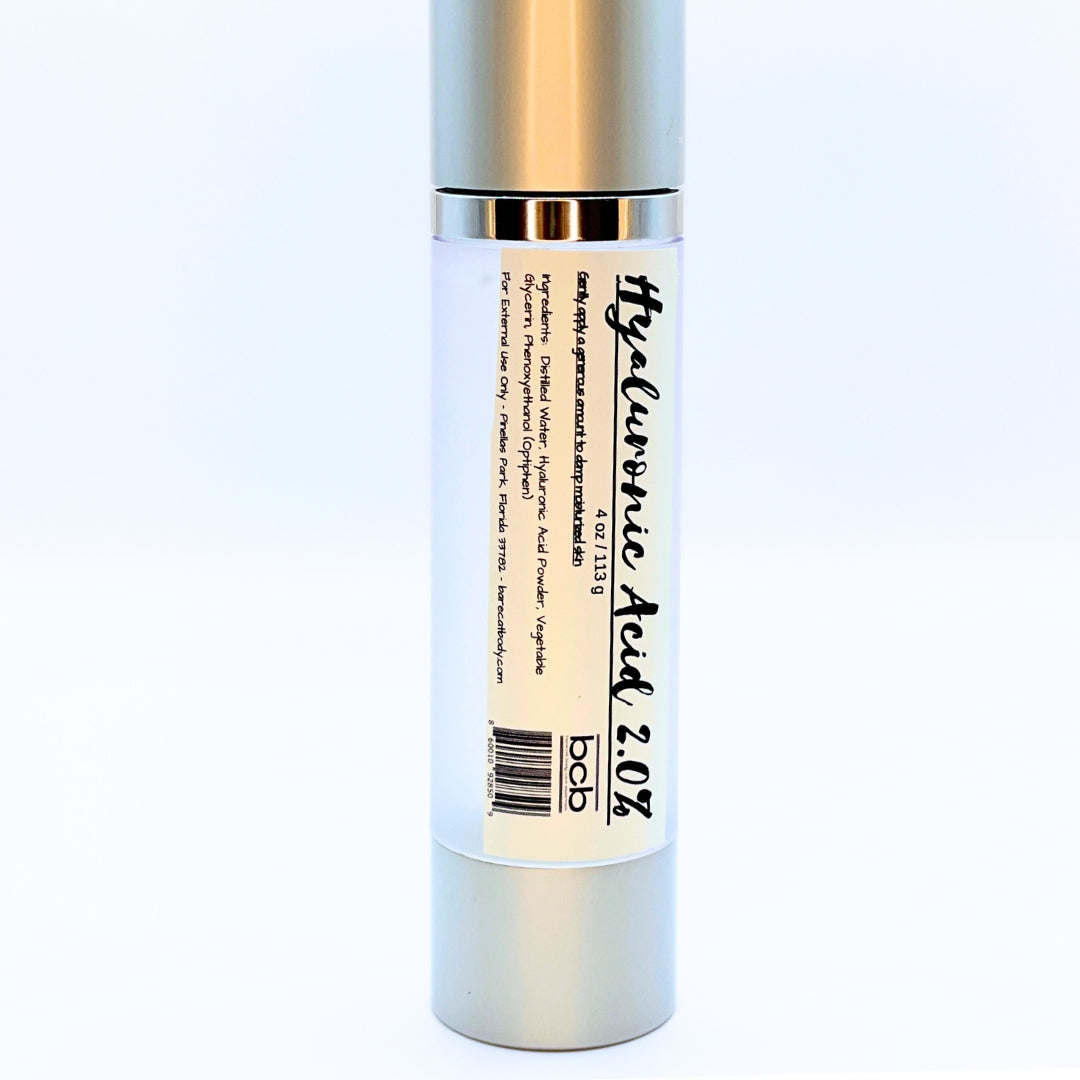 Bottle of 2 oz Hyaluronic Acid Serum showing clear liquid and simple, elegant labeling.