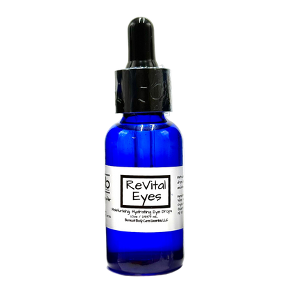 Blue bottle of 'ReVital Eyes' eye drops on a white background