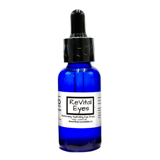 Blue bottle of 'ReVital Eyes' eye drops on a white background