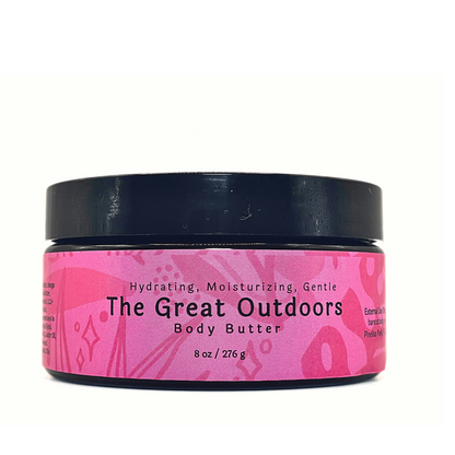 Great Outdoors Body Butter jar showcasing its rich texture infused with Vanilla, Cedarwood, and Ylang Ylang.